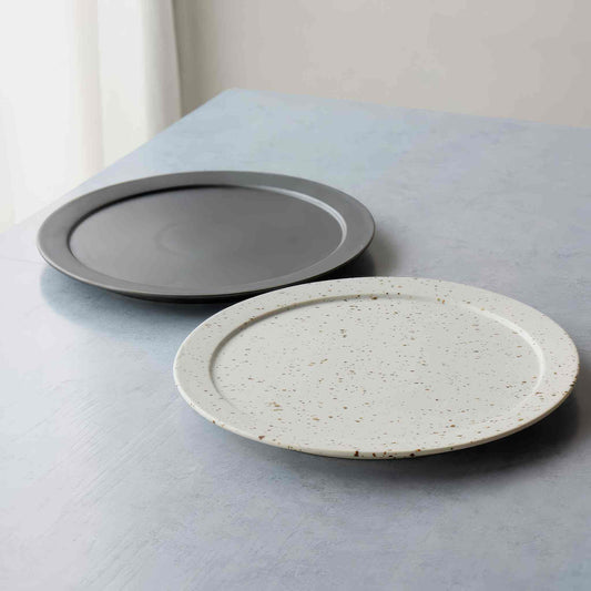 Handmade black and white Arita ware-inspired plate with natural speckled glaze.