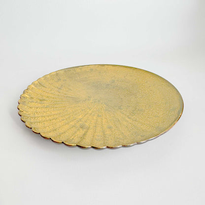 Gold decorative plate on a white background