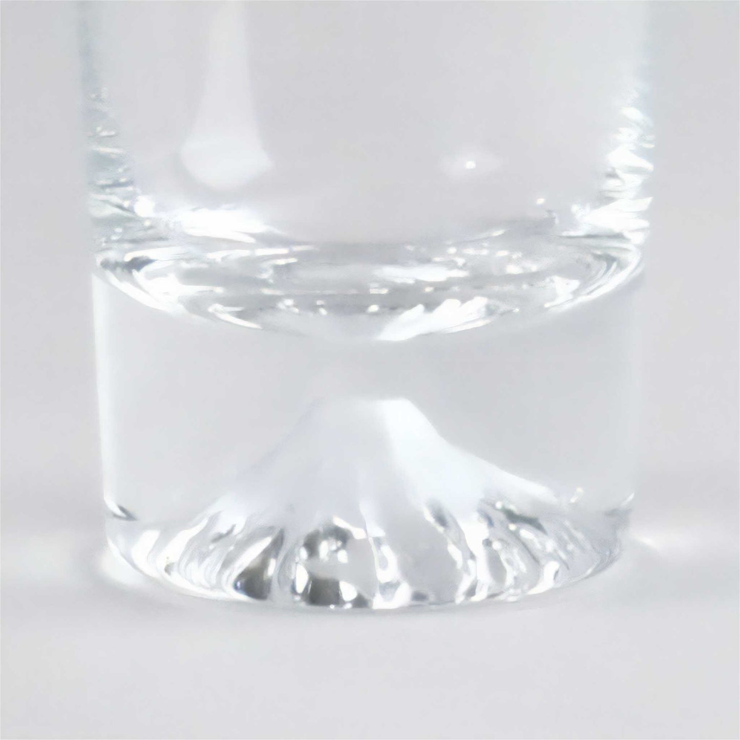 Clear glass tumbler on a white background