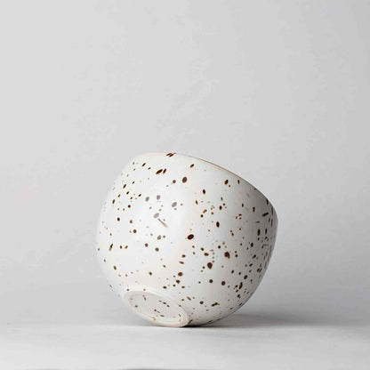 Handcrafted speckled wabi-sabi ceramic mug with saucer, Arita ware.