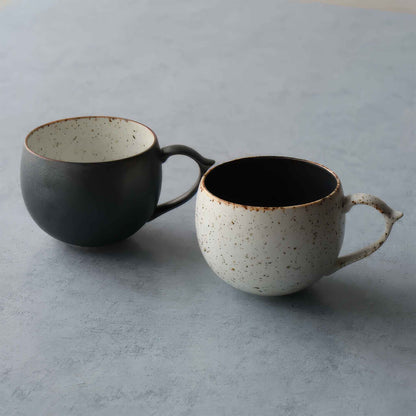 Handcrafted black and white wabi-sabi ceramic mug, Arita ware.