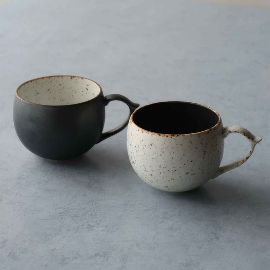Handcrafted black and white wabi-sabi ceramic mug, Arita ware.
