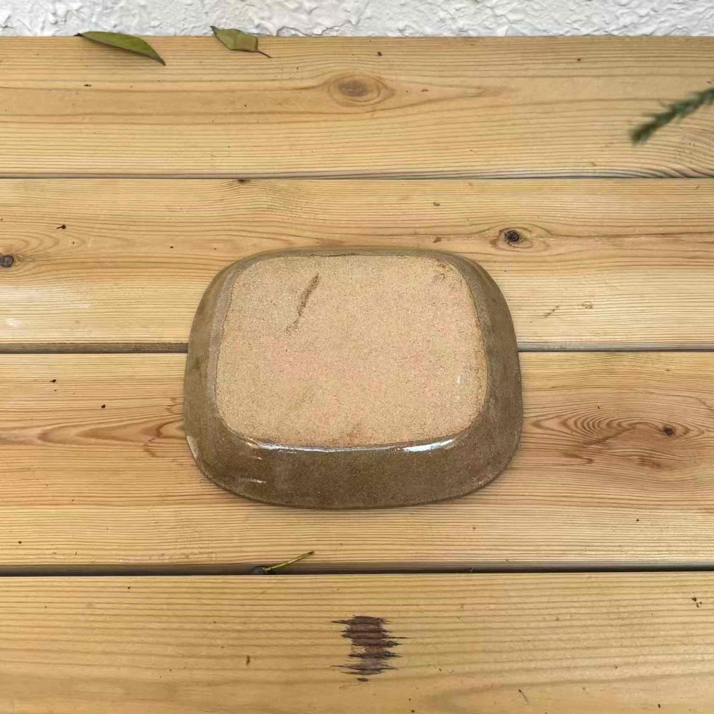 Handmade slipware square plate with unique, hand-applied surface patterns.