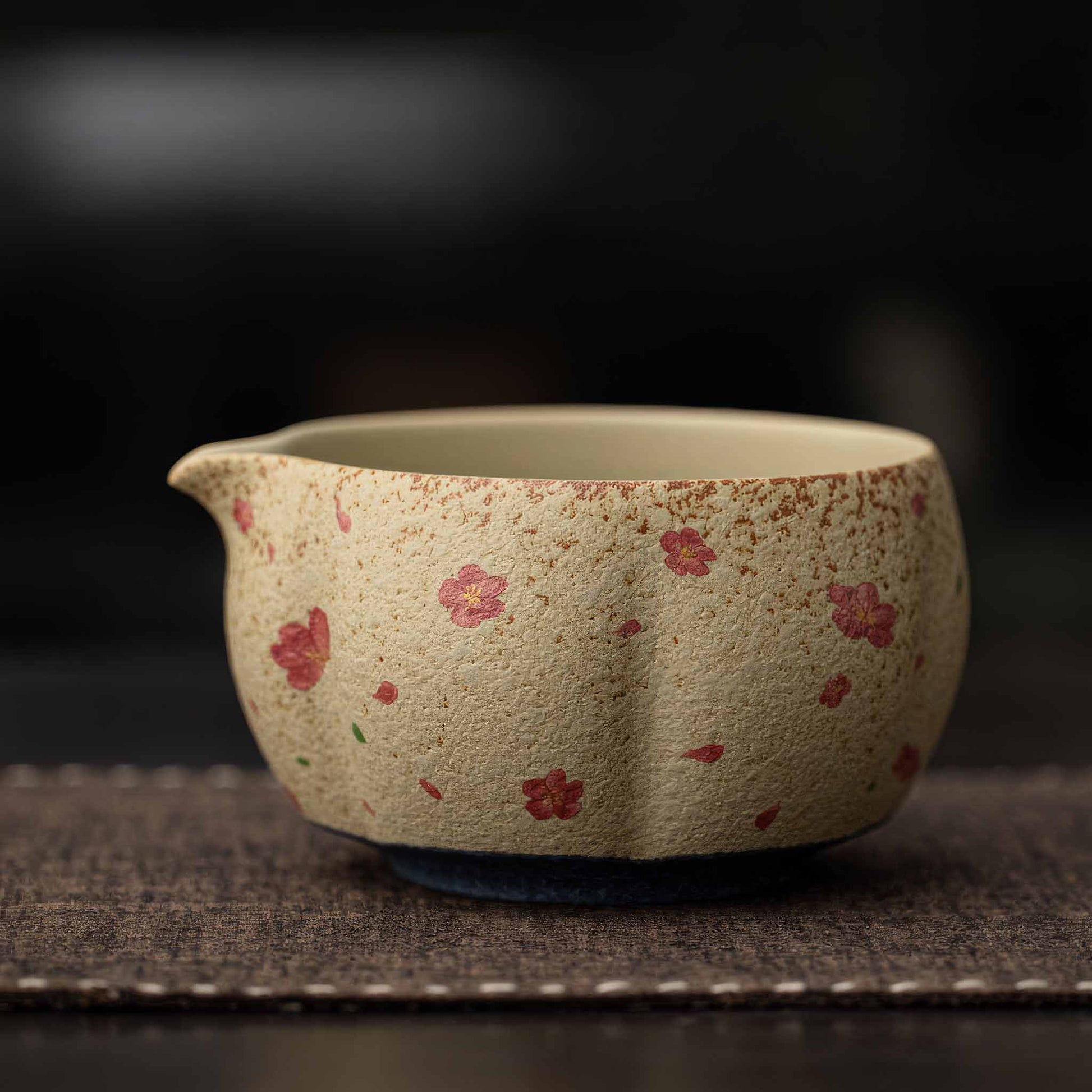 A hand-painted, handcrafted, and hand-finished matcha bowl set with a natural, earthy feel, made from flint red and blue and white ceramic materials.