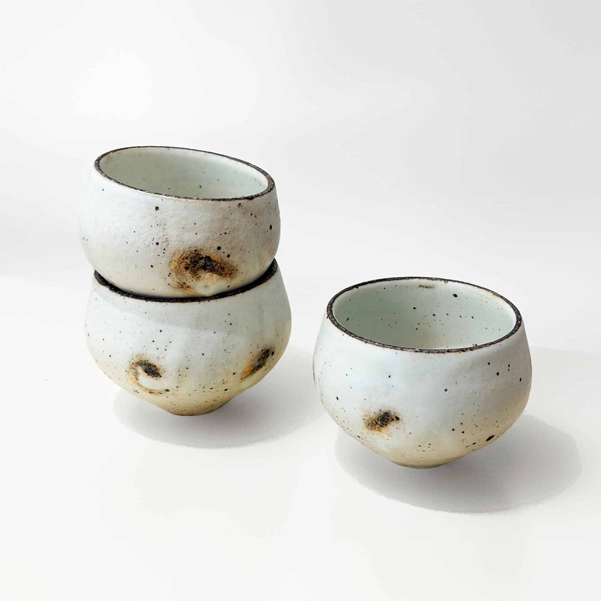 Handmade ceramic soup cup with a natural glaze, featuring subtle textures and a simple design.