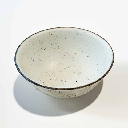 Handmade V-Shape Bowl by Takashi Sogo in white kohiki glaze, set against a neutral background.