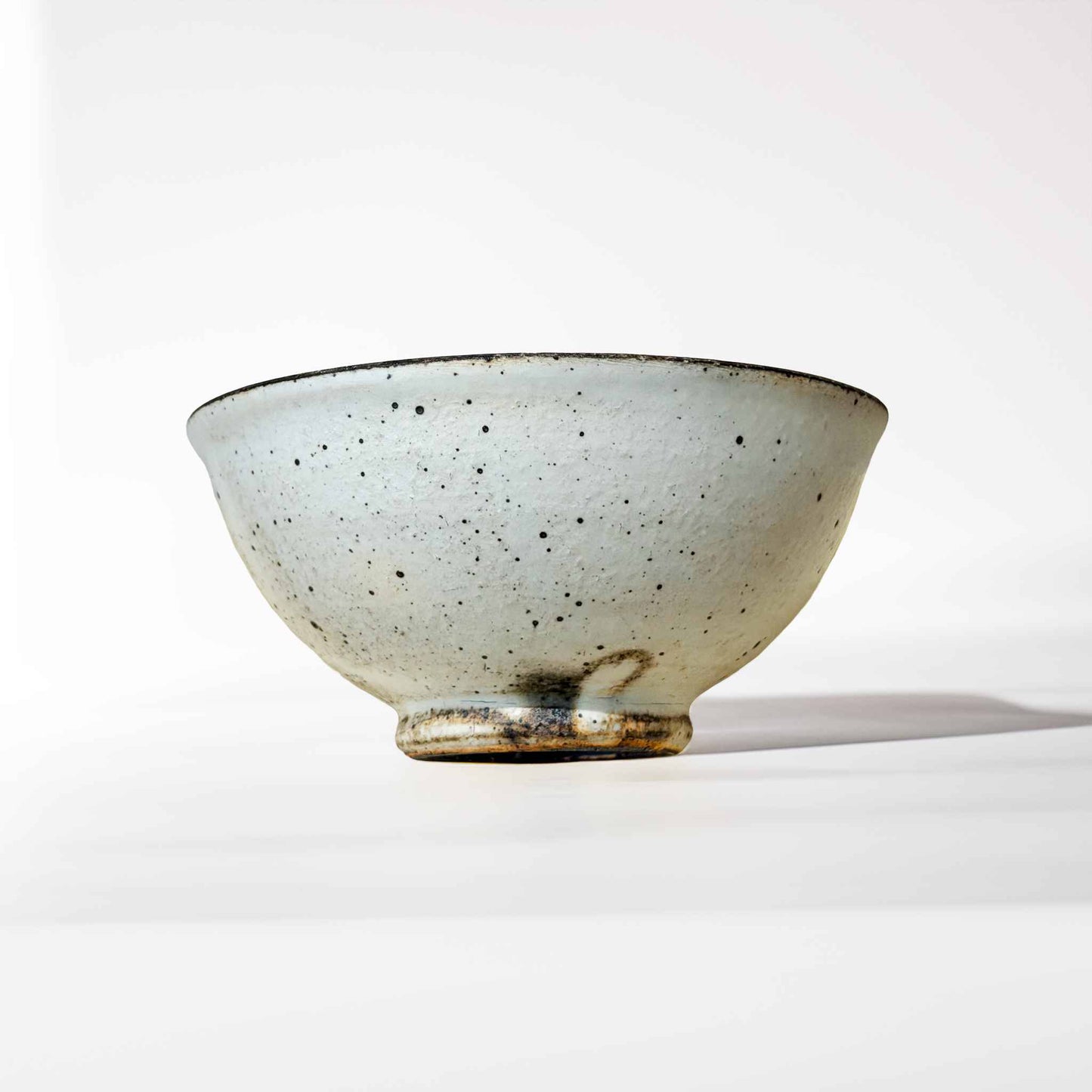Handmade V-Shape Bowl with kohiki glaze, made of ceramic, on a white background.