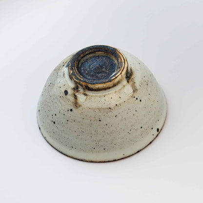 Handmade V-Shape Bowl with kohiki glaze, set against a neutral background.