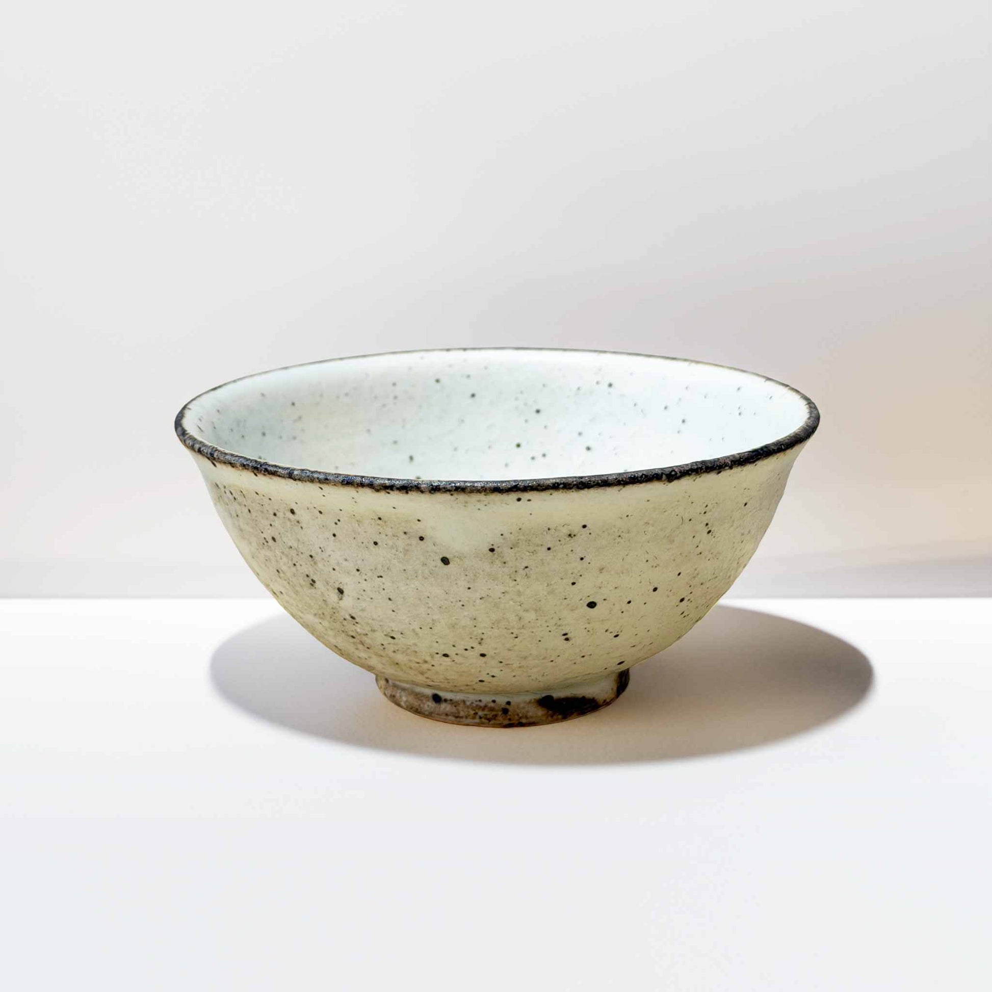 Handmade V-Shape Bowl with kohiki glaze, made by Takashi Sogo.