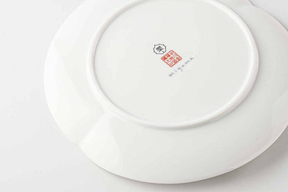 Side view of 8-inch white Mino ware plate with Yezo hydrangea botanical design.